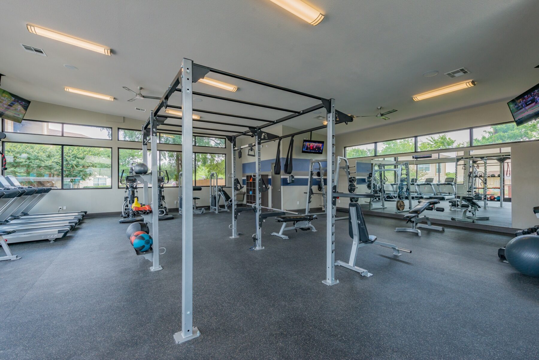 Laurel Canyon brand new gym with ceiling fans, tvs, strength, cardio, and big windows