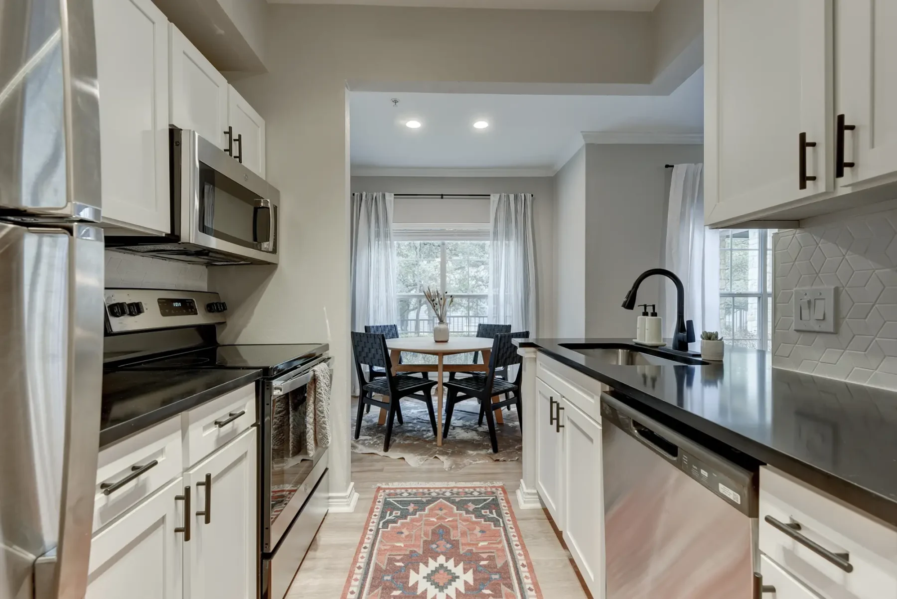 Kitchen with cabinets, drawers, and stainless-steel appliances