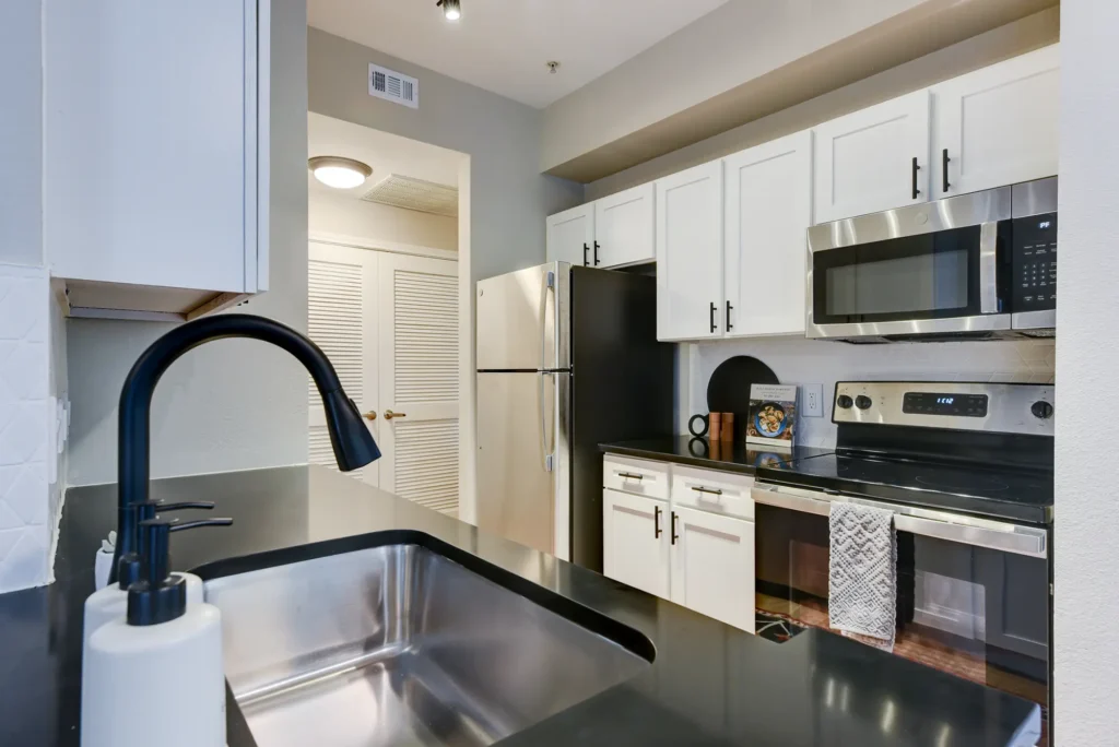 Kitchen with cabinets, drawers, and stainless-steel appliances
