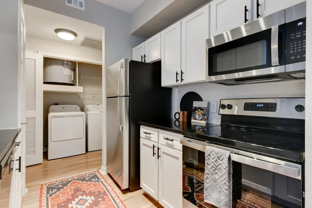 Kitchen with cabinets, drawers, and stainless-steel appliances