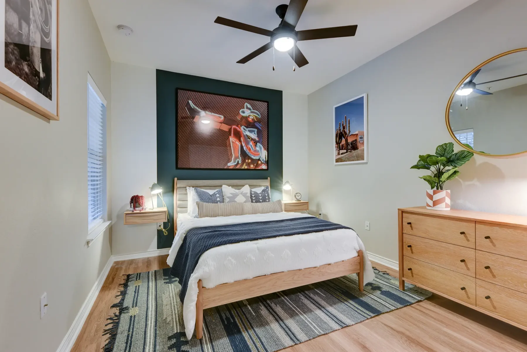 Bedroom with wood-style flooring, window, and ceiling fan